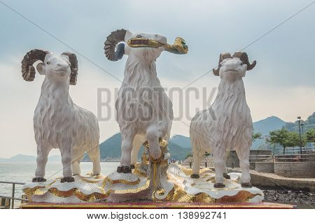 REPULSE BAY HONG KONG - MAY 23: The statues of three celestial rams presenting the jade scepter of prosperity to the people of Hong Kong in Kwun Yam temple on May 23 2016 in Repulse Bay Hong Kong.