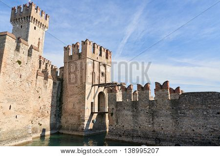 The Scaliger Castle is a medieval port fortification located at the entrance to the sirmio peninsula which divides the lower part of Lake Garda.