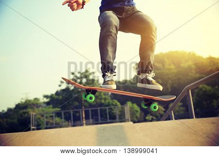 one young woman skateboarder skateboarding at skatepark