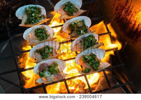 Grilled Oysters On Fire With Oil, Green Onion, Roasted Peanut