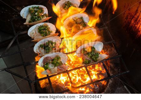 Grilled Oysters On Fire With Oil, Green Onion, Roasted Peanut