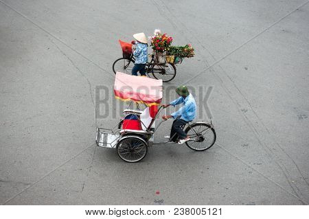 Cyclo Or Pedicab Driver On Hanoi Street