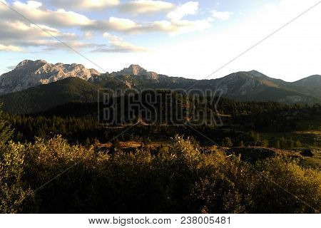 View Of The Mountains And The Forest During Sunrise.