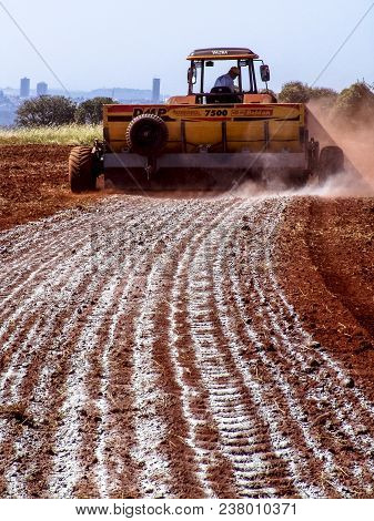 Ribeirao Preto, Sao Paulo, Brazil, May 19, 2006. Mechanized Application Of Limestone In A Field For 