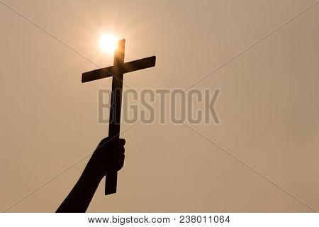 Human Hand Holding A Cross, The Background Is The Sunrise., Concept For Christian, Christianity, Cat