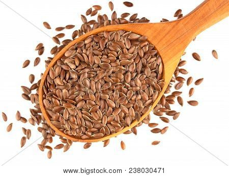 Flax Seeds In Wooden Spoon Isolated On White Background.  Also Known As Linseed, Flaxseed And Common