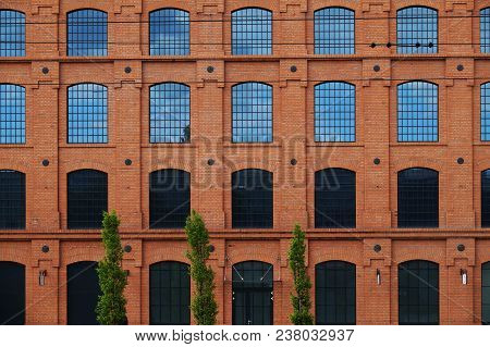 The Building Of The Old Factory Has Been Renovated And Revitalized. Color Scheme, Window Arrangement