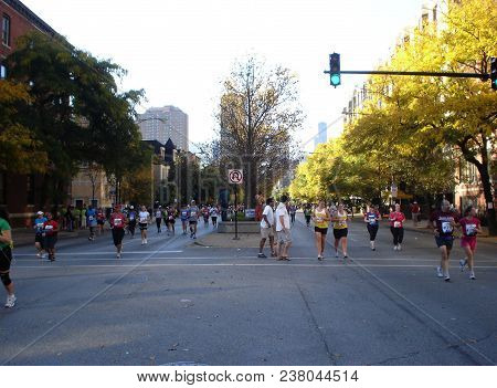 People Running The Chicago Marathon On Lasalle St. With Specators Watching, Chicago, Il October 10, 