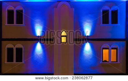 Several Windows In A Row On Night Illuminated Facade Of The Urban Classic Building Front View, Sochi