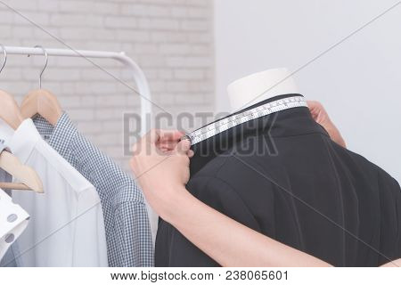 Fashion Designer Hand Is Measuring Jacket Nack