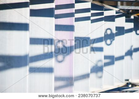 Metal Structures In A Warehouse In Stacks. Metal Supports For Scaffolding And Formwork. Soft Focus A