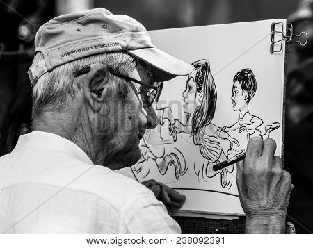 Paris, France - July 06, 2017: The Painter Works At The Open Air Artist Market At The Tertre Square 