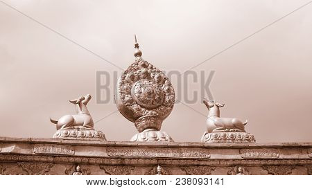 Brass Statue On The Roof With Sky,sepia Tone