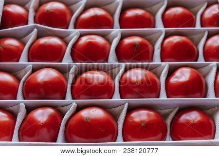 Juicy Tomatoes In A Box, Fruits Lie Separately.