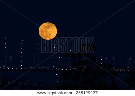 Super Blue Blood Moon Behind Bosphorus Bridge In Istanbul, Turkey