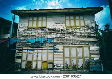 Old House On Thanon Wang Doem Road Bangkok, Thailand. Translation Of All Signs Is 