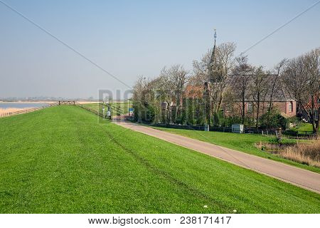 Little Dutch Village Gaast With Church Behind Dam For Protection To The Sea