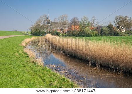 Little Dutch Village Gaast With Church Behind Dam For Protection To The Sea