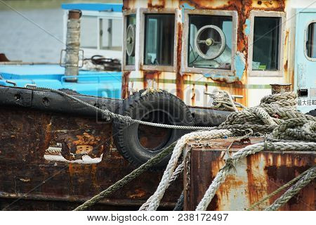 Scene Of The Workboat Of Rusted Old Iron Anchoring In The Port