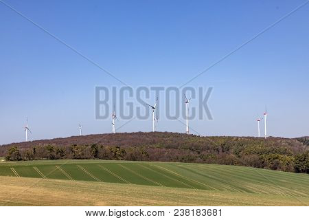 Wind Generator Produces Electric Power In Rural Landscape