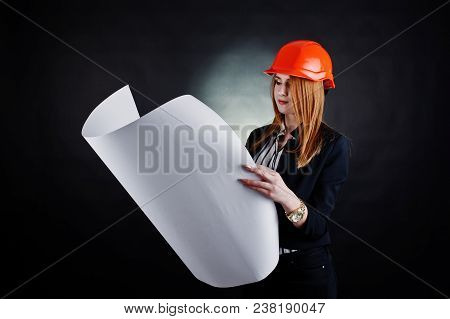 Engineer Woman In Orange Protect Helmet With Construction Paper Projekt.