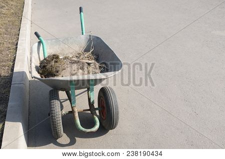Wheelbarrow With Garbage, Cleaning Of The Territory