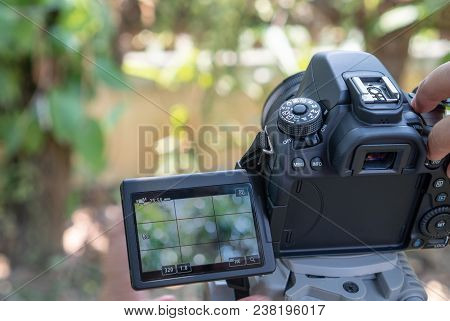 Thailand-april 15, 2018: Black Dslr Camera For Photographers Using Camera Located On Tripod To Take 