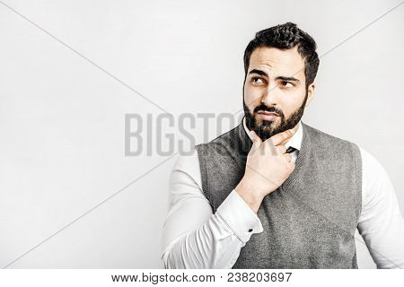 Portrait Of Happy Bearded Eastern Thinking Businessman On Isolated White Background