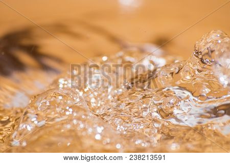 Shining Drop Of Water Colored Of Orange Isolated Composition