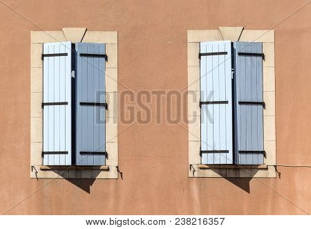 Traditional French Window With Wooden Shutters At An Old House In Provence Orange Color