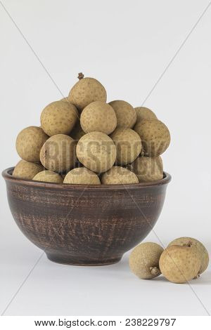 Longan In Ceramic Pial Isolated On White Background - (exotic Fruit)