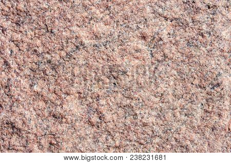 Facing Material Rose Granite Texture. Natural Stone Rose Granite Untreated Background Texture. Brigh