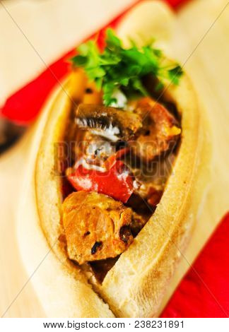 Goulash With Large Pieces Of Meat And Vegetables, All Served In Bread