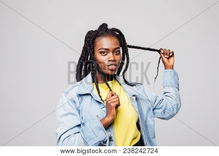 Portrait Of Woman With Hair Braided In Thin Plaits Or Dreadlocks In African Style Isolated On Gray B