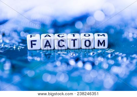 Word Factom Formed By Alphabet Blocks On Mother Cryptocurrency Closeup