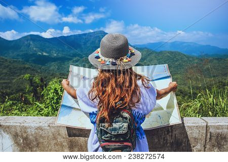 Asian Woman Travel Relax In The Holiday. Stand Natural Touch Mountain Field Summer. View Map Travel 