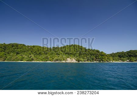 Scenic Sea View Of The Kapas Island At Terengganu, Malaysia. Clear Sea Water And Blue Sky Background