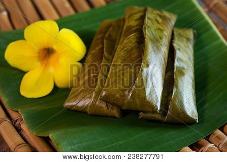 Sticky Rice Wrapped In Leaves And Served With Peanut Sauce. Famous Cuisine In Borneo. Brunei, Sarawa