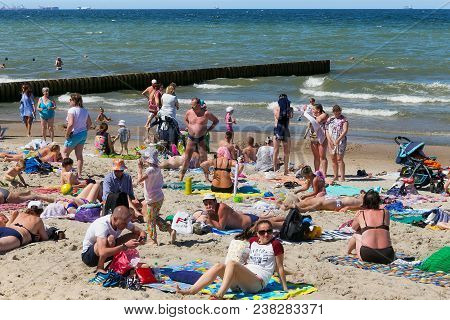 Zelenogradsk, Kaliningrad Region, Russia - July 29, 2017: Unknown People Resting On A Sandy Beach On
