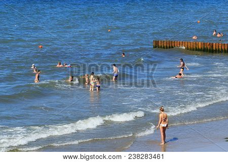 Zelenogradsk, Kaliningrad Region, Russia - July 29, 2017: Unknown People Bathing The Baltic Sea Wate