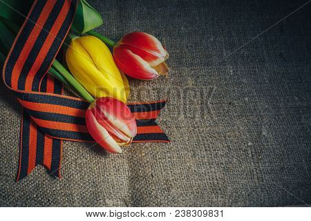 Military Cap With Order Of Great Patriotic War And Tulips Flowers Tied By Saint George Ribbon In Hon