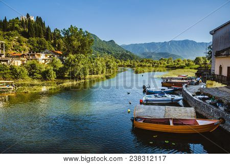 June, 8th, 2016 - Skadar Lake, Montenegro. Fishing Boats, Mountains And Shore Houses On Tsrnoyevicha