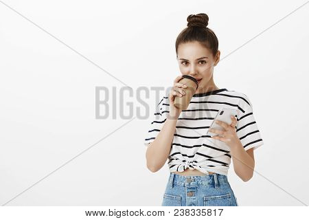 Creative Girlfriend Intrigued With Interesting Story. Attractive Feminine European Woman With Bun Ha