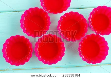 Red Silicone Molds For Cupcakes. Prepare The Jelly. Top View On A Wooden Background