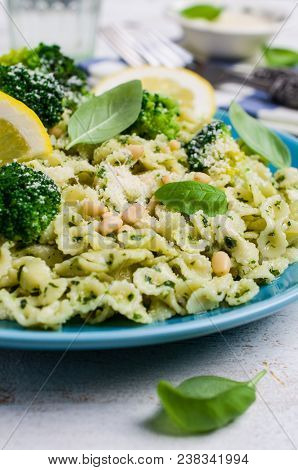 Traditional Pasta Tripoline With Pesto And Broccoli In A Plate On The Table. Selective Focus.
