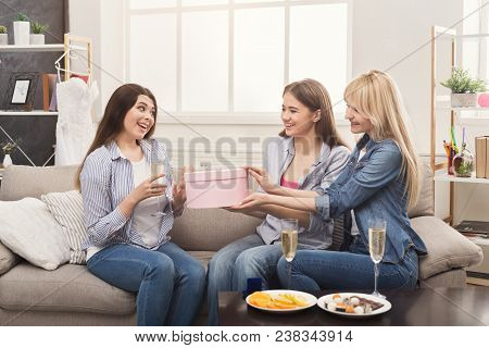 Excited Woman Getting Present From Her Friends. Celebration, Henparty Before Wedding And Female Frie