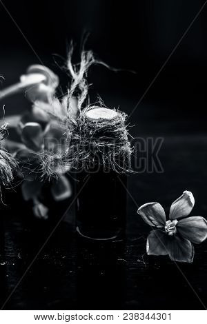 Ayurvedic And Floral Essence Of Rangoon Creeper Or Chinese Honeysuckle Or Madhumalti In A Transparen