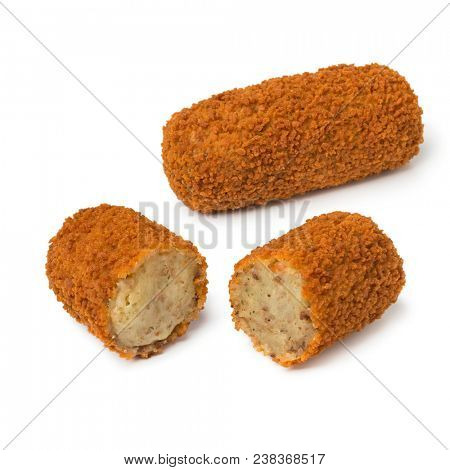 Single deep fried Dutch kroket and a sliced one isolated on white background
