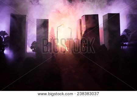 Empty Street Of Burnt Up City, Flames On The Ground And Blasts With Smoke In The Distance. Apocalypt