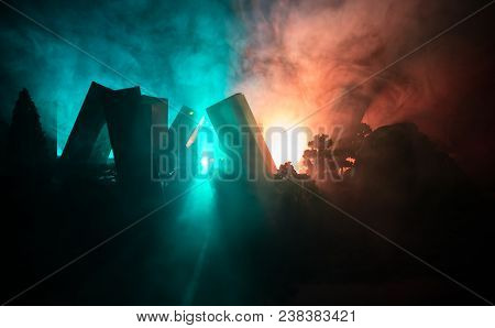 Empty Street Of Burnt Up City, Flames On The Ground And Blasts With Smoke In The Distance. Apocalypt